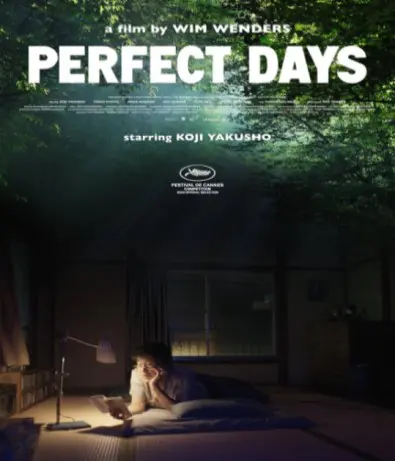 FIlm poster for "Perfect Days" sees an Asian man lying on the floor reading a paperback book by lamplight. 